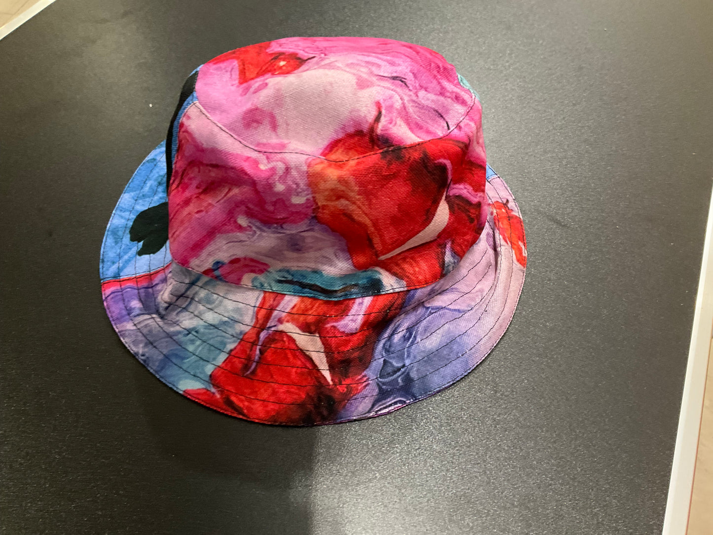 Hannah Nishat Botero LA PALOMA All-Over Print Reversible Bucket Hat